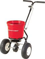 Earthway 2150 50 lb commercial broadcast spreader with a red round hopper and pneumatic tires.