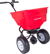 Earthway 2170 100 lb commercial broadcast spreader with a large red hopper and pneumatic tires.