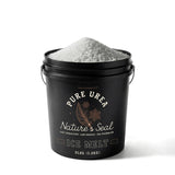 Nature's Seal Pure Urea Ice Melt 8 lb black bucket heaped with white pellets.