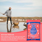 Solar salt harvest at an evaporation pond with a Softener Shield Salt bag and a with rust remover banner.