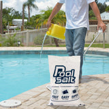 Man pouring pool salt solution into an inground pool next to a Pool Salt bag.