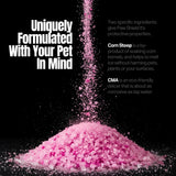 Pink ice melt granules pouring into a pile, text corn steep and CMA.